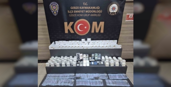 Gebze'de iş yerinde sahte 75 bin dolar ve gümrük kaçağı ürünler ele geçirildi