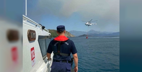Göcek yangınında kritik görev: Sahil Güvenlik, hava araçlarına kalkan oluyor