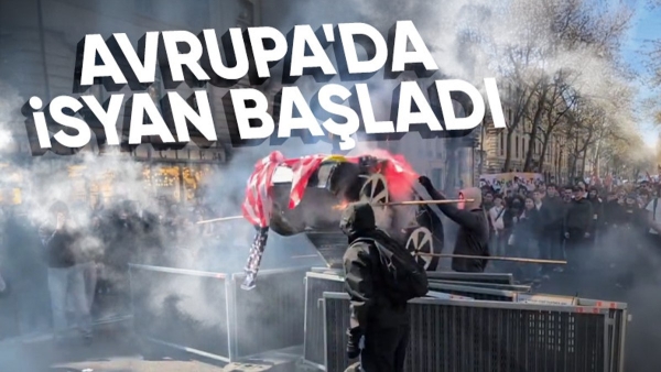 Fransa'da eylem yapan öğrenciler Tesla maketi ve ABD bayrağı yaktı